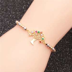 Colorful mixed bead bracelet with Tree of Life and zircon crown on a wrist