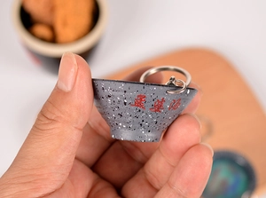 Detailed view of creative Mengpo Soup miniature bowl keychain for bag decoration