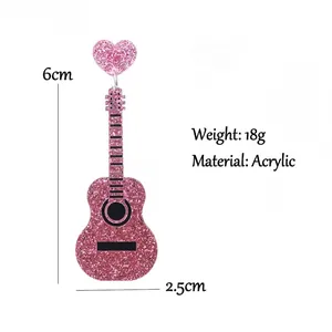 Vintage style pink glitter guitar earrings made of acrylic with heart charm detail