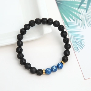 Elastic beaded bracelet with black lava stone and blue imperial jasper accent beads