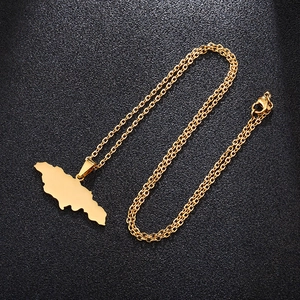 Detailed view of a gold Jamaica map pendant with an O-chain on a black matte background