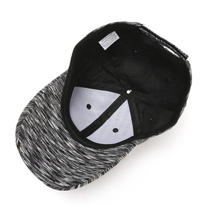 Detailed interior of a cotton baseball cap with fabric care label showing materials
