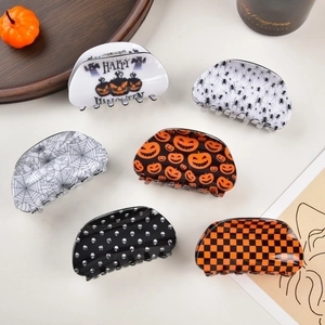 Set of 6 Halloween hair claws featuring pumpkin, spider, and skull designs for women
