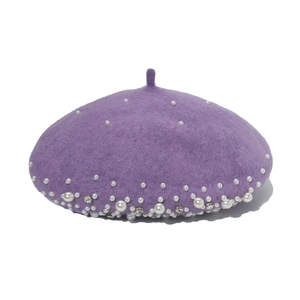 Purple wool beret with pearl and rhinestone embellishments, minimalist front view