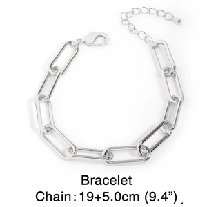 Detail view of silver paperclip chain bracelet with adjustable lobster clasp and extension