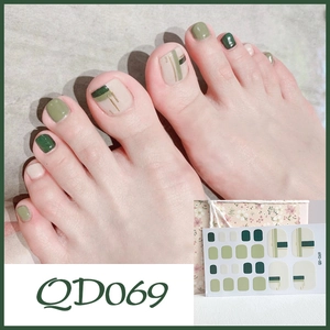 Green and beige minimalist toe nail stickers with gold lines and packaging detail