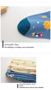 Close-up of smooth toe seams and soft cotton fabric on astronaut-themed crew socks