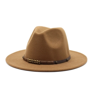 Classic brown felt fedora hat with a vintage woven decorative band and metal accents