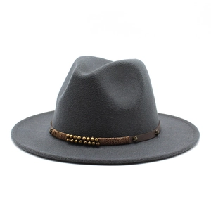 Close-up of gray wool fedora hat with braided leather band and vintage metallic beads