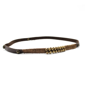 Detail of vintage leather headband with metallic beads and intricate wire-wrapped craftsmanship