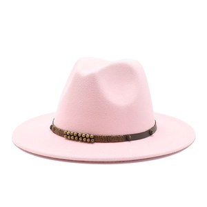 Detail of light pink wool felt fedora featuring a dark brown beaded and studded band