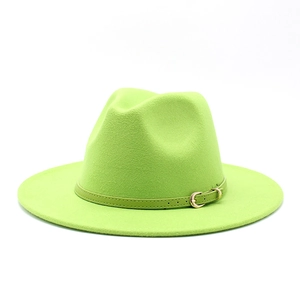 Detailed macro view of lime green wool fedora with a matching leather band and gold buckle