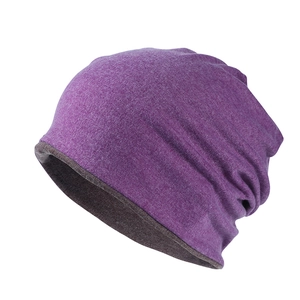 Detail shot of purple and gray dual-layer knitted beanie showing soft fabric texture