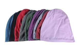 Collection of colorful knitted windproof beanies in various shades for autumn and winter