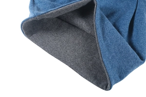 Detail view of the dual-layer knit beanie featuring a blue exterior and grey lining