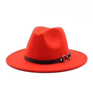Detail of red wool fedora hat with black leather band and silver triple ring metal trim