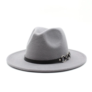 Close-up of a grey wool fedora featuring a black ribbon band and interlocking silver rings