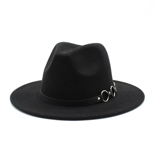 Detail of classic black wool fedora featuring thin leather band with silver metal rings