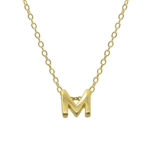 Close-up of golden letter M pendant on a delicate sterling silver chain necklace
