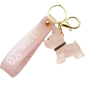 Pink crystal French Bulldog keychain with gold ring and XBOOM lanyard on white background