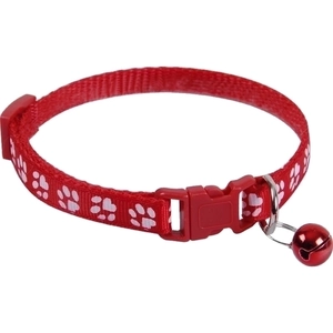 Red pet collar with white paw prints, adjustable buckle and red bell on white background