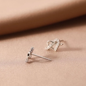 Elegant 925 sterling silver heart-shaped stud earrings with white zircon stones