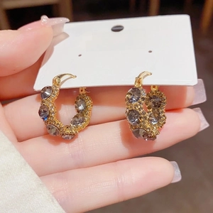 Elegant gold-plated C-shaped hoop earrings with grey cat eye stone and cubic zirconia