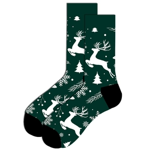 Detail of dark green Christmas socks featuring reindeer, snowflake and tree patterns