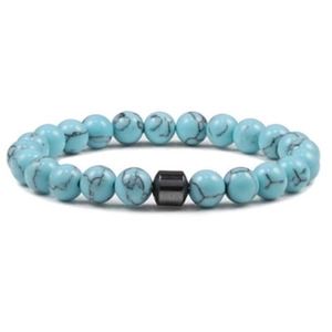 Macro detail of 8mm turquoise beaded bracelet showing natural texture and black hematite spacer