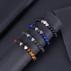 Handmade tiger eye and lava stone bead bracelets set with silver heart charms