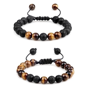 Detail of adjustable 8mm green tiger eye and black lava stone beaded bracelets