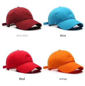 Detail view of cotton baseball caps in wine red, blue, red and orange colors