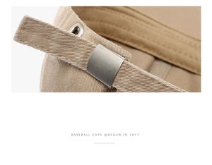 Detail of adjustable metal buckle and cotton strap on a khaki baseball cap