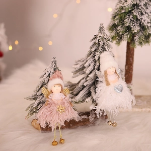 Pink and white Christmas angel doll ornaments with feather wings and bells on wood base