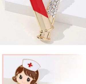 Macro detail of alloy enamel nurse brooch with shiny rhinestones and golden accents