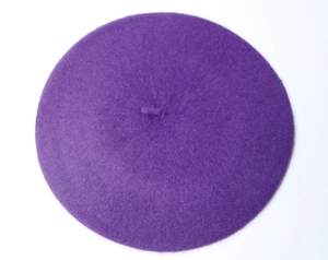 Top-down view of a classic purple wool felt beret for children with a clean minimalist design