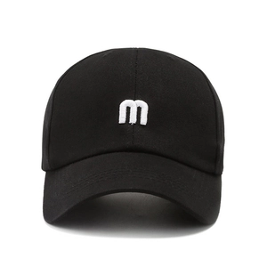 Classic black cotton baseball cap with white 3D letter m embroidery and curved brim