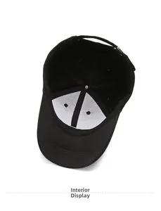 Detail view of the black cotton baseball cap interior featuring a white support lining