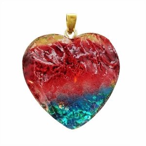 Macro shot of a colorful heart-shaped crystal pendant with vibrant gradient resin textures