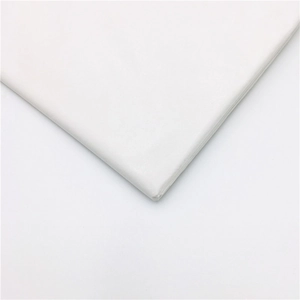 Macro detail of white laser pearly tissue paper showing textured layers for floral wrapping