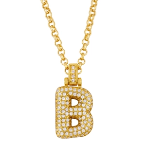 Macro shot of gold-plated letter B pendant necklace with pavé-set shimmering crystals