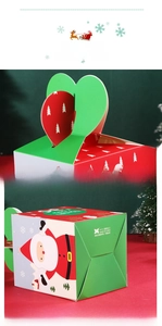Detail of Christmas apple box with heart handle and cartoon Santa Claus pattern