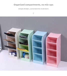 Detail of multi-compartment diagonal desk organizer in four pastel colors with stationery