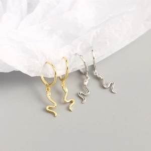 Detailed view of S925 sterling silver snake hoop earrings in gold and silver finish