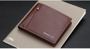 Detail of dark brown leather men's wallet with lychee grain and contrast stitching