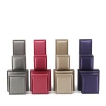 Detailed macro view of high-quality jewelry boxes in grey, burgundy, gold and purple tones