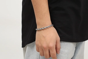 Silver 6mm stainless steel rope chain bracelet shown on wrist in side profile view