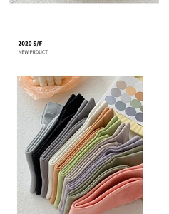Detailed view of Morandi-colored knit socks with fine vertical ribbed texture and cotton blend