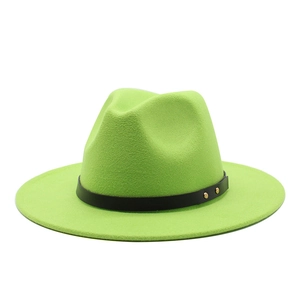 Detailed close-up of fluorescent green wool fedora with black leather band and gold rivets