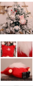 Macro shot of embroidered snowflake on plush gnome ornaments with dense faux fur beards